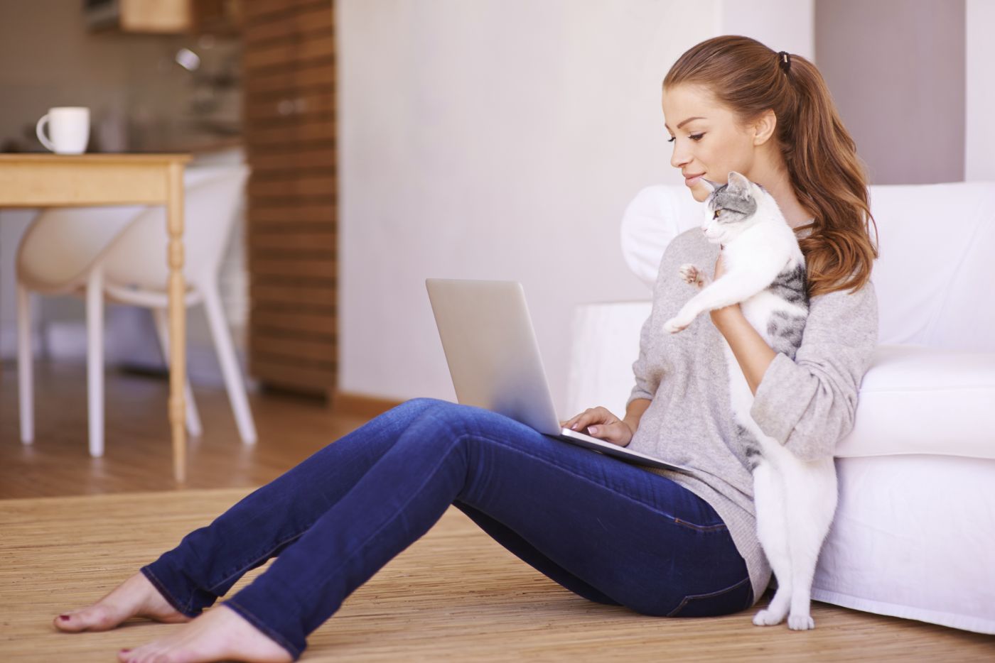 Woman and cat and laptop